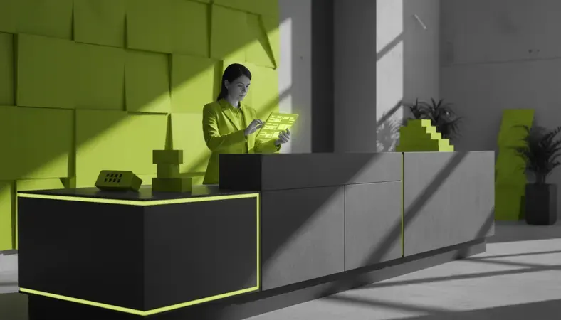 Hotel operations manager reviewing staff schedules on a tablet at the front desk