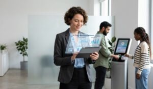 Employees using a digital workforce management platform for mobile time tracking, attendance, and employee scheduling in a modern workplace.
